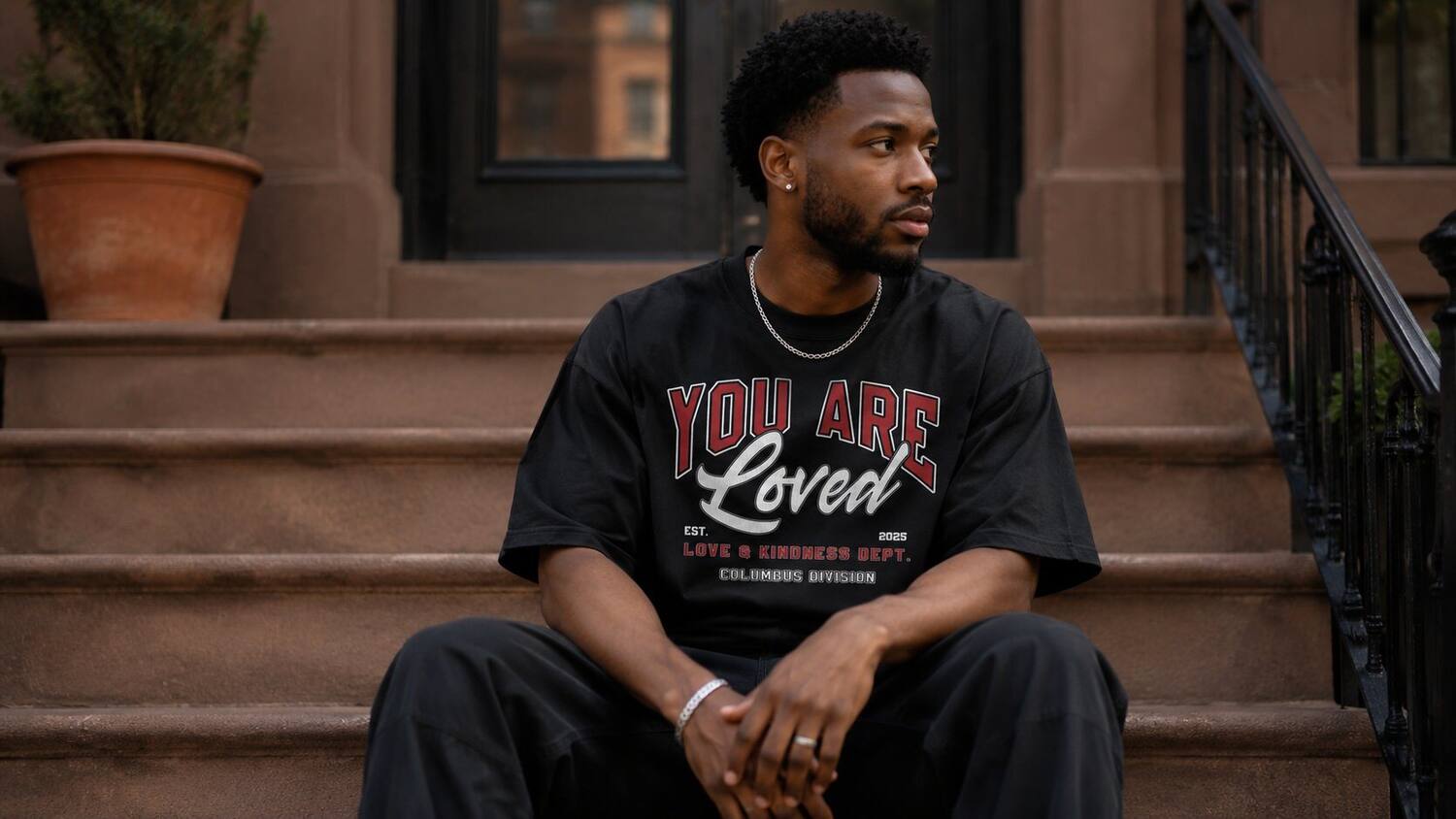 Varsity tee on a stoop